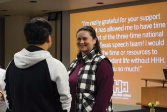A student speaks with a mentor at a Horns Helping Horns event